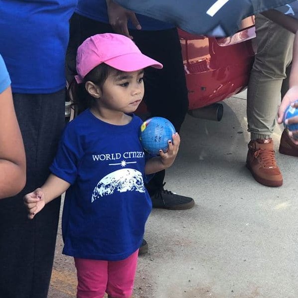 Girl wearing World Citizen T-shirt
