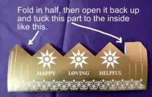 Fold in half, unfold, tuck tab down and fold in half again